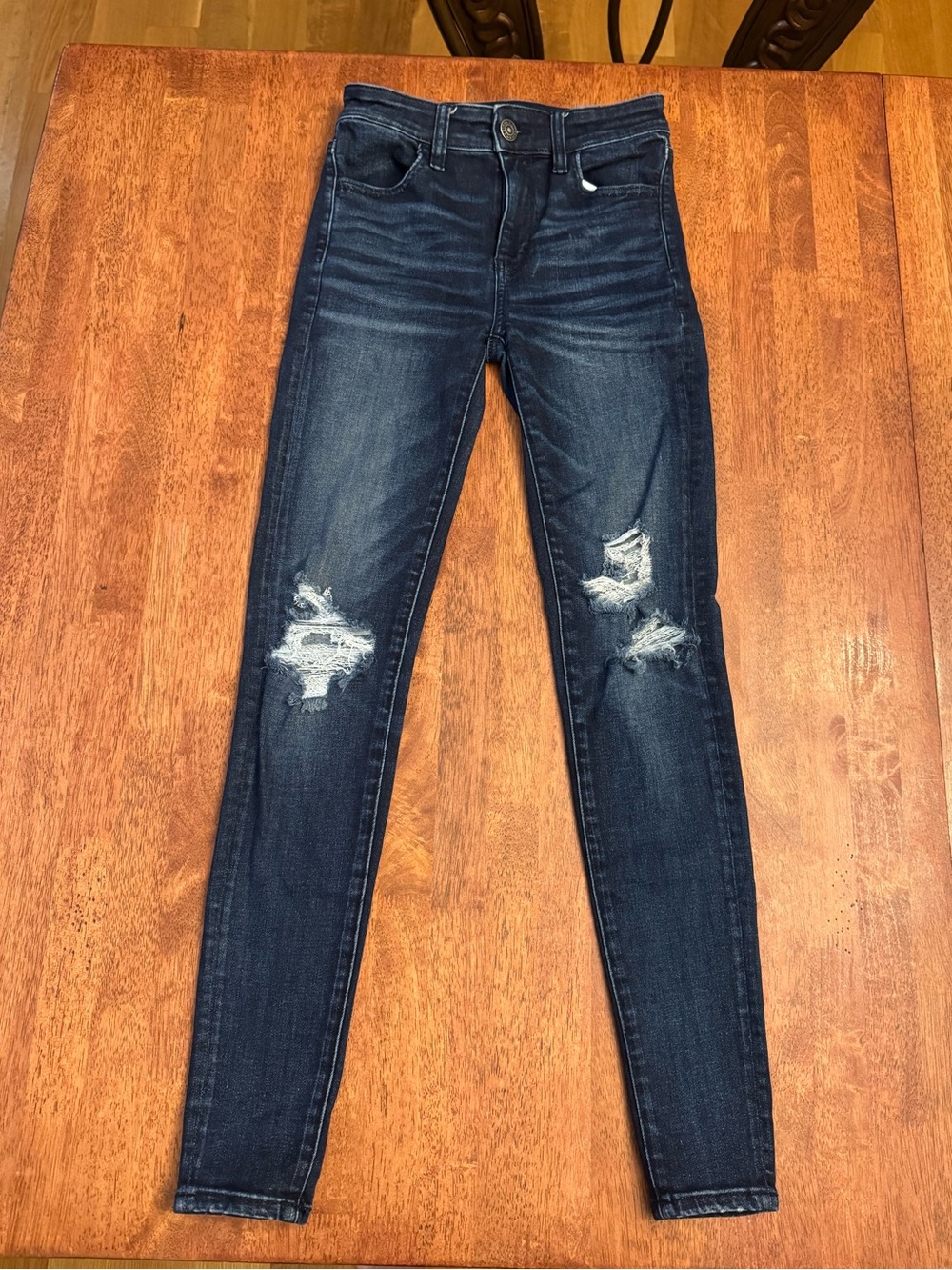American Eagle next level distressed high waisted jeggings in dark blue, size 0
